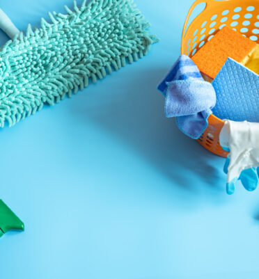 colorful-composition-with-mop-sponges-rags-gloves-detergents-general-cleaning-cleaning-service-concept-background